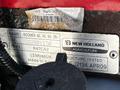 A metal identification plate for a 2018 New Holland Boomer 45 tractor displaying model name and details including serial number and manufacturing information