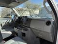 Interior view of a 2012 Ford Econoline E-450 with gray seating and dashboard featuring controls and air vents