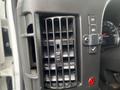 Close-up of a black air vent and control buttons on the dashboard of a 2016 Chevrolet Express