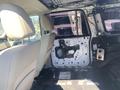 Interior view of a 2013 Ford Expedition showing the rear seating area with a partially removed door panel and exposed wiring on one side
