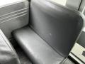 A gray vinyl seat inside a 2015 Spartan School Bus