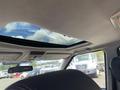 Interior view of a 2006 Land Rover LR3 showing a sunroof and the interior roof detailing with seats visible in the foreground