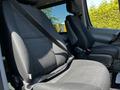 Interior view of a 2017 Mercedes-Benz Sprinter showing two black fabric seats with seatbelts fastened