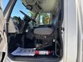 Interior view of a 2008 International DuraStar truck showing the driver's seat dashboard and fire extinguisher on the floor