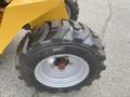2024 AGT KRW 23 Mini loader tire with a rugged tread design showcasing a silver rim and a bold black rubber exterior