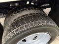 Close-up of the rear dual tires of a 2013 Ford F-550 showing tread pattern and detail of the tire and wheel assembly