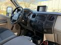 Interior view of a 2009 Ford F-550 showing the dashboard steering wheel and controls with a focus on the center console and infotainment display