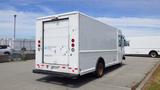 A 2011 Ford Econoline commercial van with a plain white exterior and a rear door design for cargo access