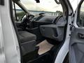 Interior view of a 2017 Ford Transit showing the driver's seat dashboard and steering wheel