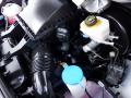 Close-up of the engine compartment of a 2016 Mercedes-Benz Sprinter showcasing various components including the air intake and fluid reservoirs