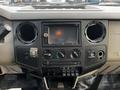 Dashboard of a 2009 Ford F-550 featuring a center console with a touchscreen display climate controls and various switches