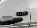 A close-up of a 2018 Ford Transit door handle featuring a keypad with numerical buttons for keyless entry