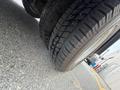 Close-up view of a tire on a 2017 Chevrolet Express showing tread patterns with a slightly angled perspective