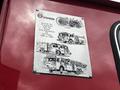 A metal plaque featuring illustrations of fire trucks with text honoring Sutphen's service to the community and commemorating 100 years of fire apparatus from 1890 to 1990
