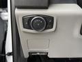 A control panel in a 2019 Ford F-350 SD featuring knobs and buttons for vehicle lighting and settings