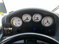Dashboard of a 2006 Emergency One Fire Truck featuring gauges for coolant, voltage, fuel, and a control panel with various switches and buttons