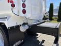 A 2019 Ford F-750 with a visible rear assembly including taillights a exhaust pipe and a mounted hitch for towing purposes