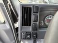 Dashboard controls of a 2017 Isuzu NPR HD including ventilation vents and various switches