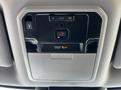 Interior control panel of a 2023 Toyota Tundra featuring buttons for door operation and emergency SOS function