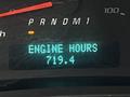 Digital display showing engine hours reading 719.4 in a GMC Savana