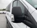 A 2017 Ford Transit with a focus on the side mirror showcasing its design and structure