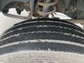 Close-up of the tread on a worn tire from a 2008 Dodge Ram 5500 showing deep grooves and visible wear on the rubber surface