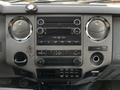 Dashboard of a 2016 Ford F-550 featuring audio controls climate settings and various buttons for vehicle functions