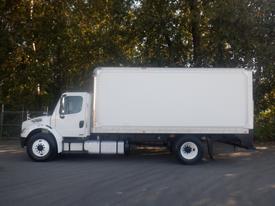 A white 2011 Freightliner M2 106 box truck parked with a plain cargo area on the back and one door on the right side