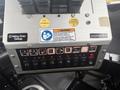 Control panel of a 2016 Freightliner 108SD with various switches and buttons labeled for different functions including light controls and warnings