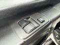 Close-up of the door control panel of a 2017 Hino 338 featuring window control buttons and a lock switch