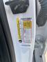 A white 2017 Ford F-150 door frame displaying a vehicle information label with details such as the VIN and other specifications
