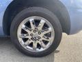 Close-up of a shiny chrome wheel with a multi-spoke design mounted on a tire labeled General Altimax