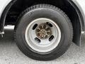 Close-up of a wheel and tire from a 2019 Chevrolet Express showing the tire tread and wheel rim with lug nuts