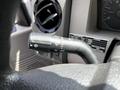 Close-up of the control stalk in a 2009 Ford F-550 showing various settings and indicators for lights and wipers