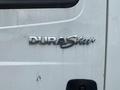 Close-up of the chrome DuraStar badge on a white 2014 International Durastar truck