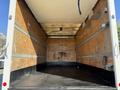 A 2014 Hino 195 truck with an empty cargo box featuring wooden walls and a flat rubber floor