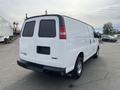 White 2012 GMC Savana van parked with no visible license plate and a clean exterior