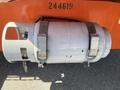 A gray cylindrical gas tank secured with metal brackets attached to a 2008 JLG Boom Lift