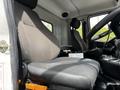The image shows the driver's seat of a 2012 Autocar Xpert with a grey fabric covering and adjustable controls on the side