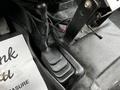A close-up view of the floor area inside a 2016 Ford F-550 showing a black foot pedal and surrounding floor mat
