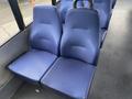 A pair of blue upholstered bus seats designed for passenger comfort with ergonomic backrests and seat cushions