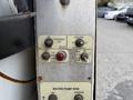 Control panel with buttons for outrigger leg, low water alarm, hose reel, and water pump RPM on a 2016 Peterbilt 348