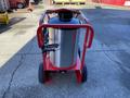 2024 Magnum 4000 Hot Water Pressure Washer featuring a large cylindrical stainless steel tank mounted on a red cart with wheels and a spray wand attached