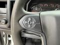 Steering wheel of a 2016 GMC Sierra 1500 with buttons for cruise control settings including resume, set, and other controls