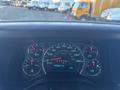 Dashboard of a 2017 Chevrolet Express displaying speedometer fuel gauge and odometer with readings of 83411 km and temperature at 4 degrees Celsius