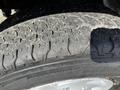 Close-up of a tire from a 2008 Ford Econoline showing tread pattern and wear on the rubber surface