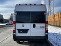 A 2017 RAM Promaster van with a white exterior is shown from the rear view featuring a dark window and visible rear lights