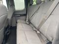 A 2017 Ford F-550 with a gray interior featuring a spacious rear seat with seat belts and fabric upholstery