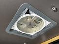 A ceiling vent fan installed in the 2017 Mercedes-Benz Sprinter with a circular design and blades visible inside the frame