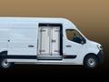 A white 2025 Ford Transit van with a large cargo area and a side door displaying a closed metal storage unit